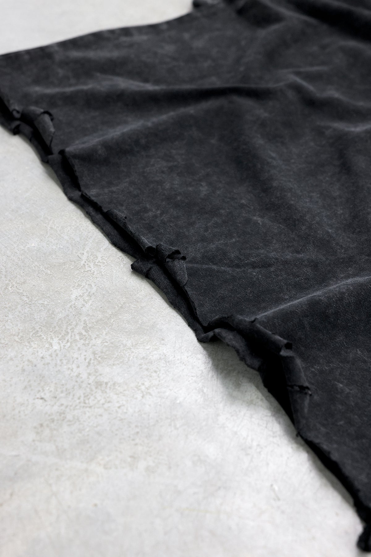 Distressed raw hem detail