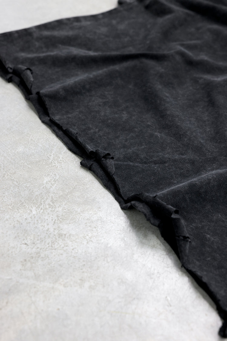 Distressed raw hem detail