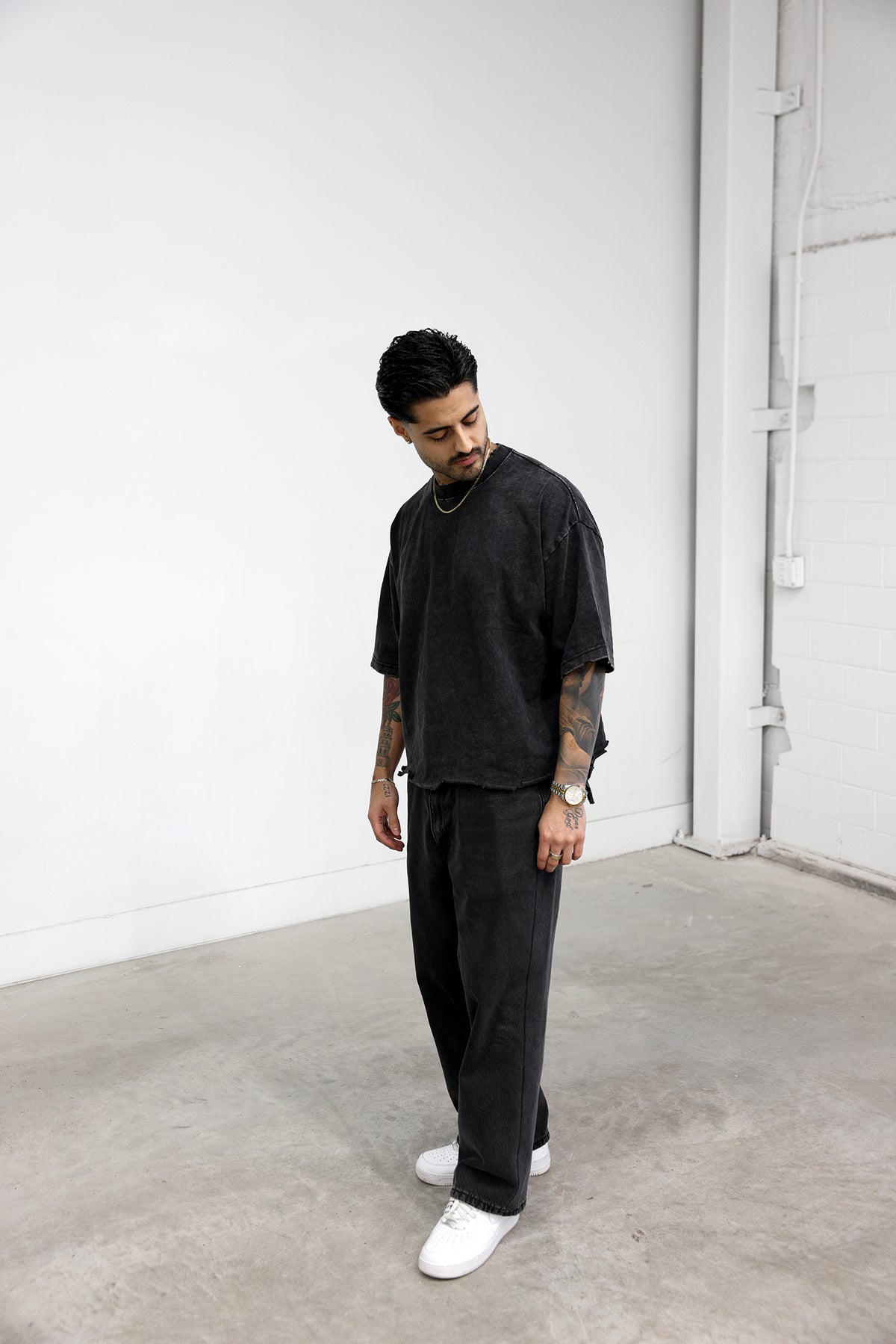 Model wearing the boxy tee, front view, size M