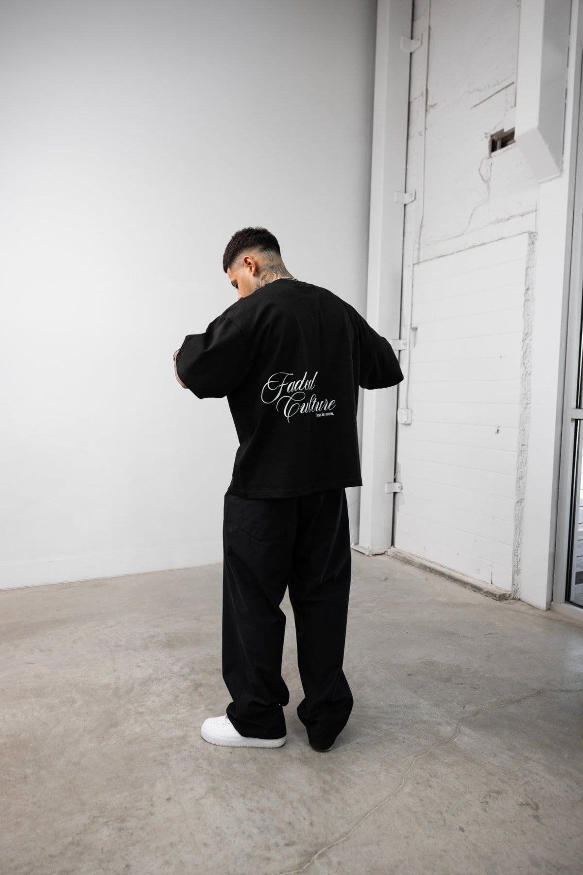 Faded Culture Less Is More tee, black — back view on model #color_black