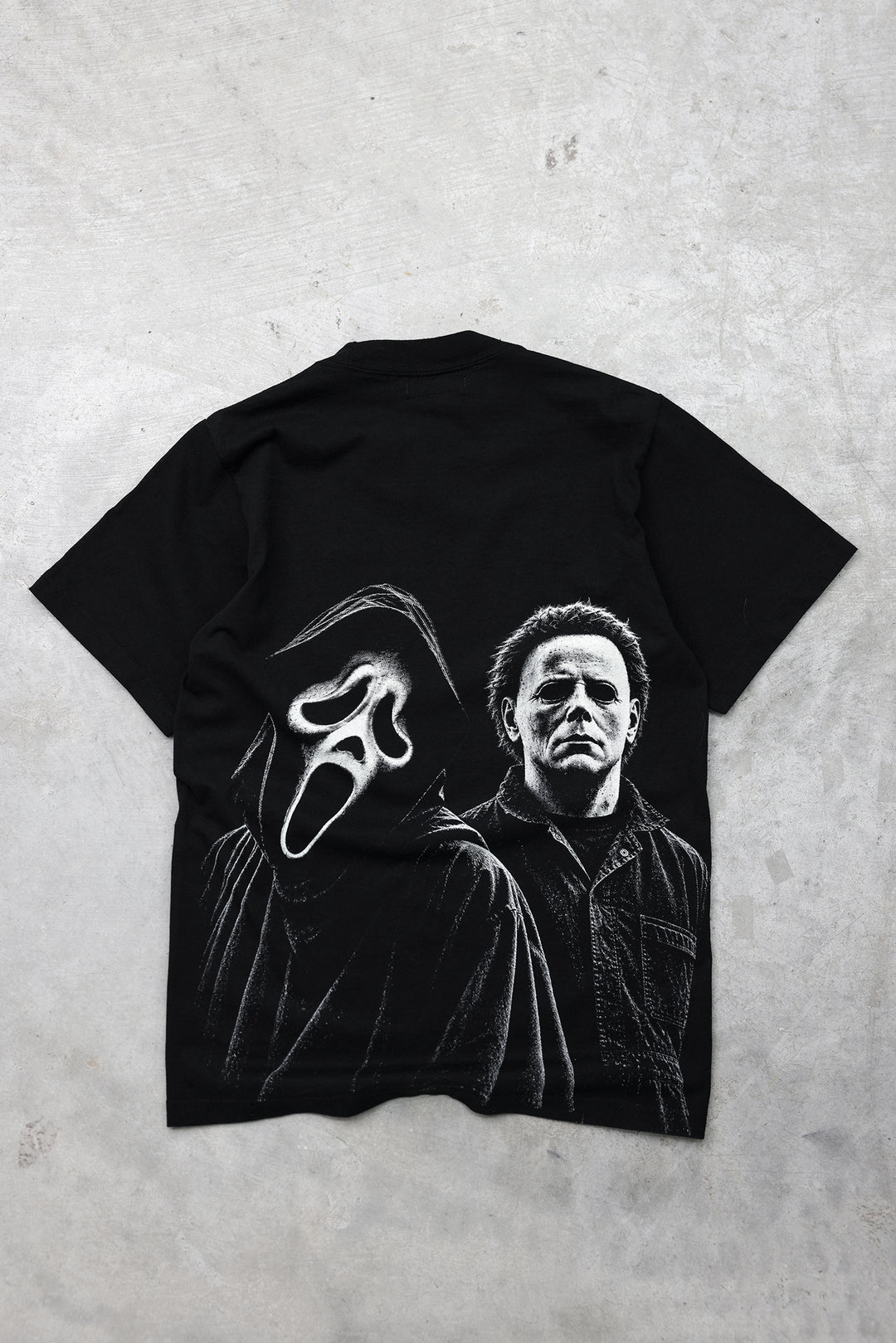 Masked Up black tee, back view with off-white masked figures graphic